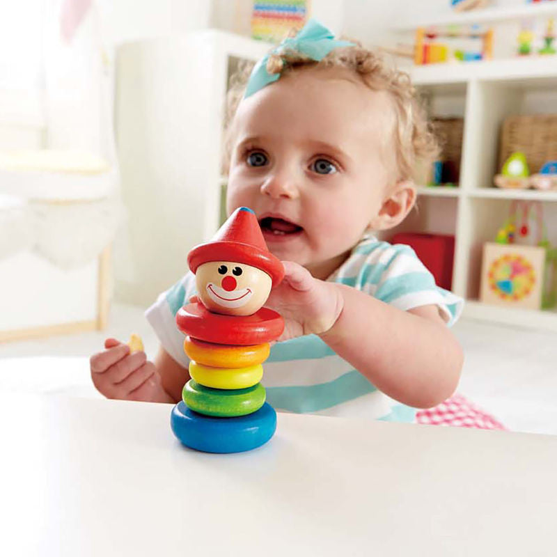 Child with colorful clown rattle