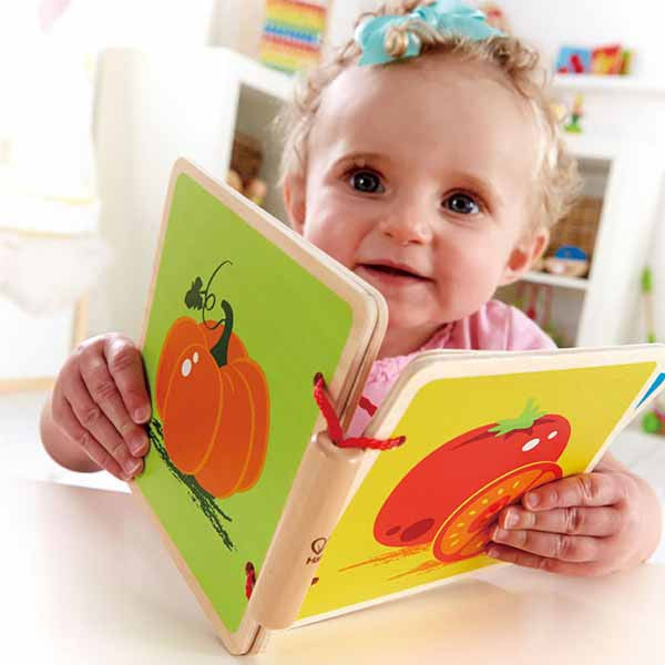 Child with First Baby Book Vegetables Theme