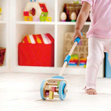 toddler with push and pull toy