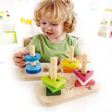 Toddler with colorful peg puzzle